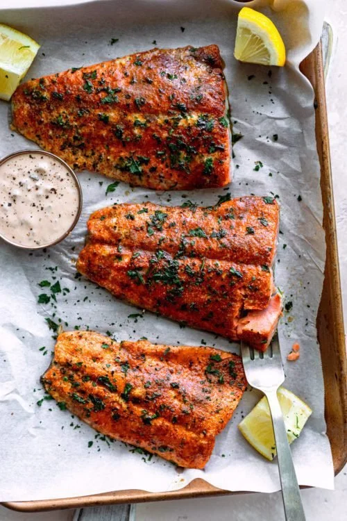 Cajun Salmon served with Spicy Tartar Sauce on a plate