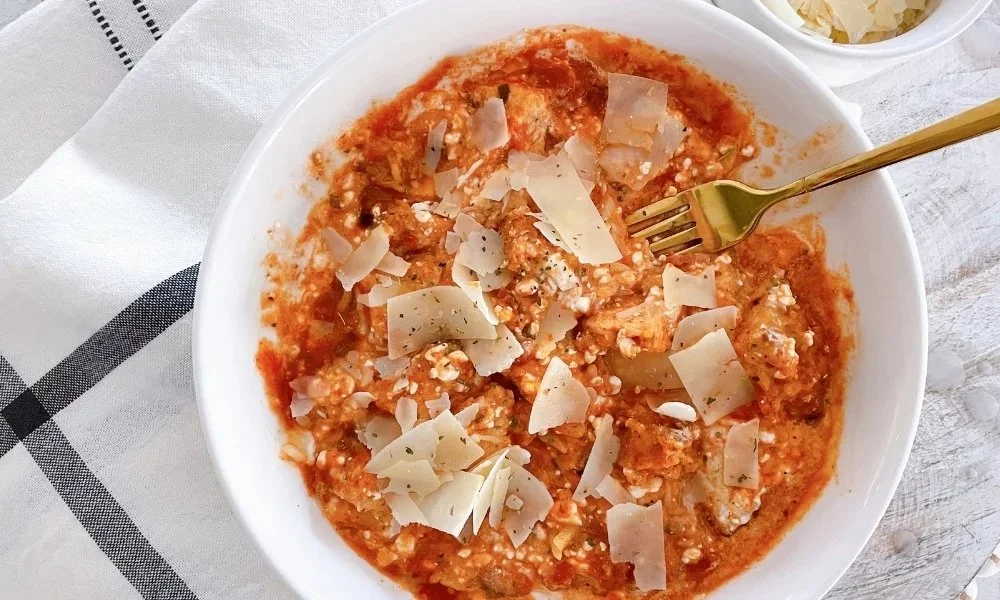 Cottage Cheese Chicken Parmesan Bowl with fresh ingredients and melted cheese