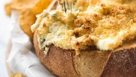 Creamy jalapeno popper dip served in a bowl with tortilla chips