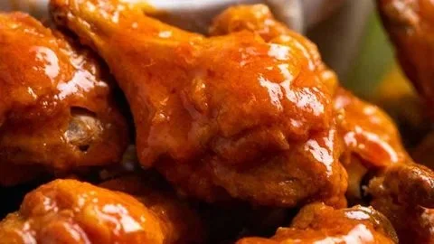 Crispy oven-baked buffalo wings served with dipping sauce