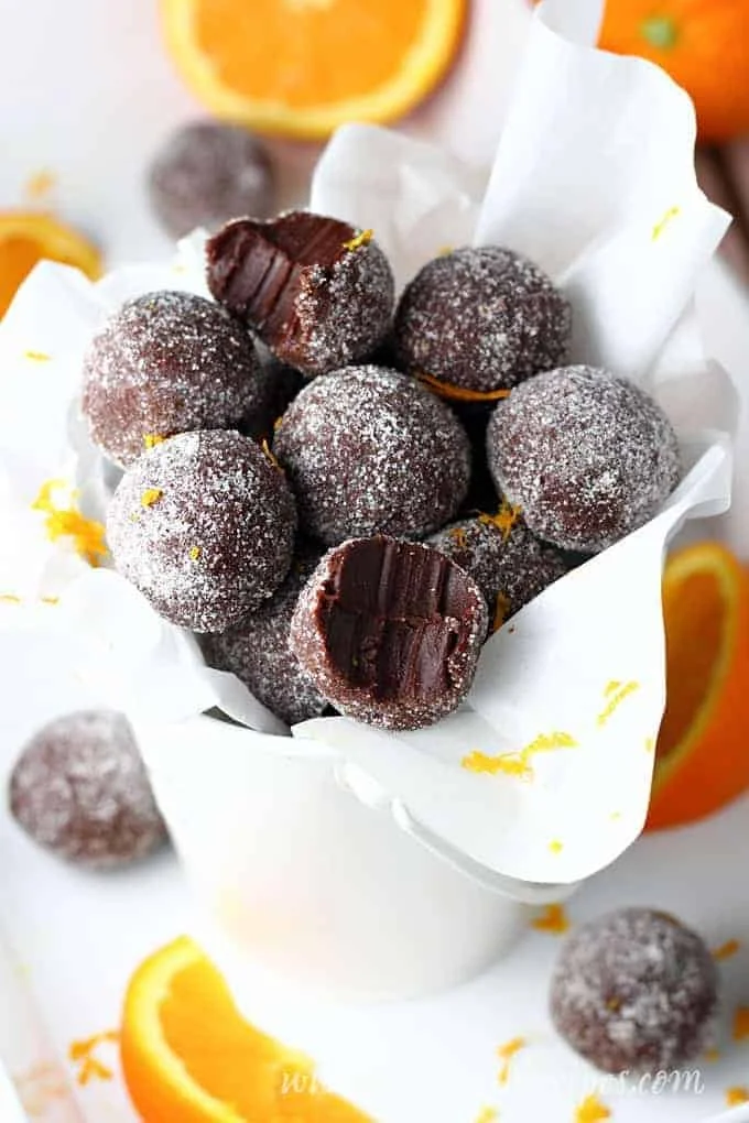 Delicious homemade easy orange chocolate truffles on a plate.