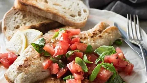 Delicious fiery salsa fish plated with fresh ingredients and vibrant salsa