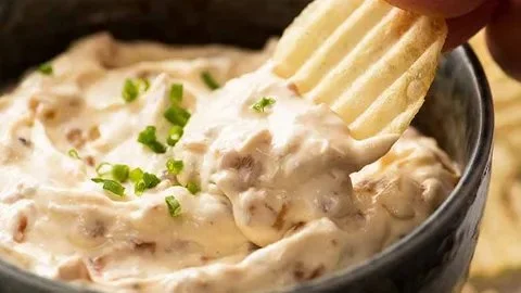 Creamy from-scratch French onion dip served with fresh vegetables and chips