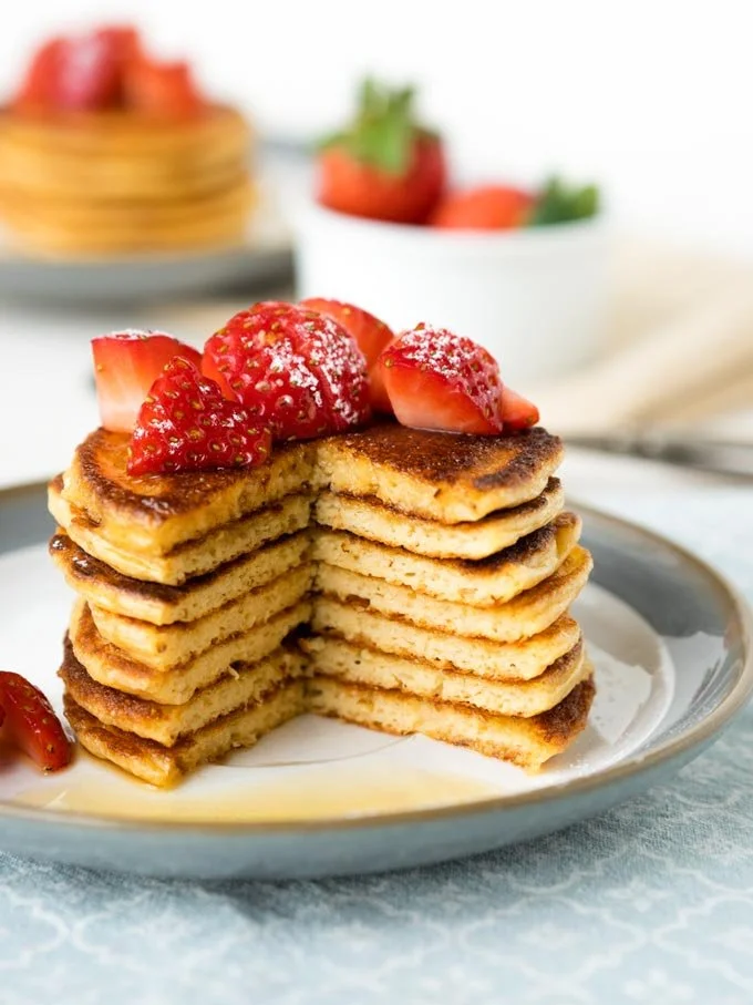 Delicious gluten-free oatmeal cottage cheese pancakes stacked on a plate