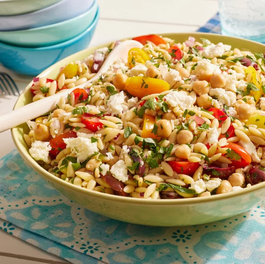 Mediterranean-inspired orzo salad with vegetables and herbs
