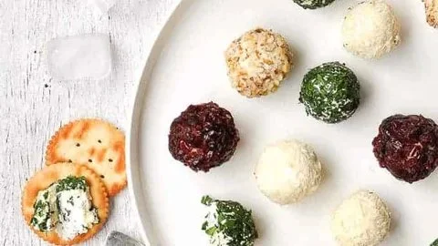Mini cheese ball truffles on a platter for party appetizers