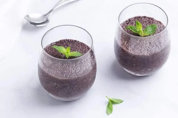 Minty chocolate chia pudding topped with fresh mint leaves
