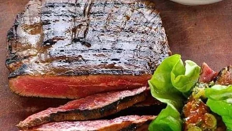 Delicious Momofuku marinated skirt steak ssam served with fresh vegetables