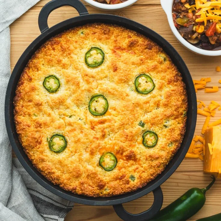 Delicious spicy jalapeño cheddar cornbread served in a rustic dish